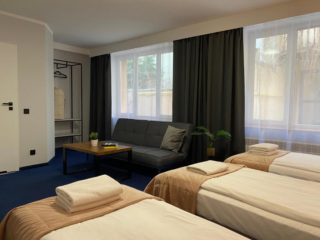Postel nebo postele na pokoji v ubytování Garbarska 22 Aparthotel