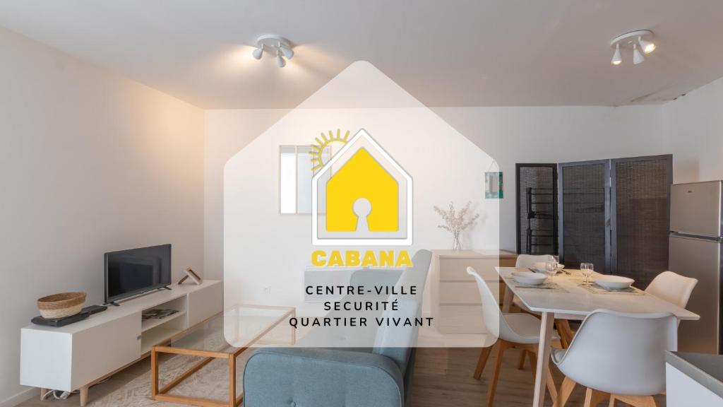 a kitchen and dining room with a sign for a house at Cabana & Hypercentre Cosy in Roanne