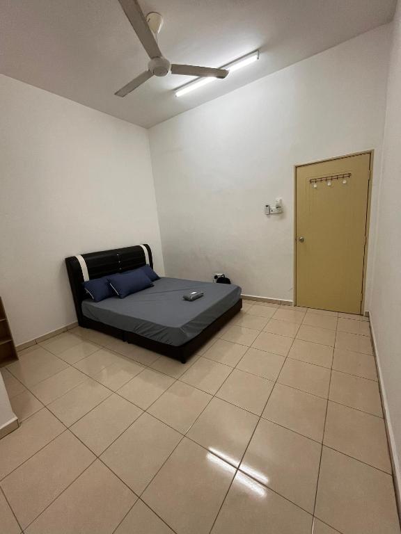 a room with a bed and a door in it at Zara Homestay in Marang
