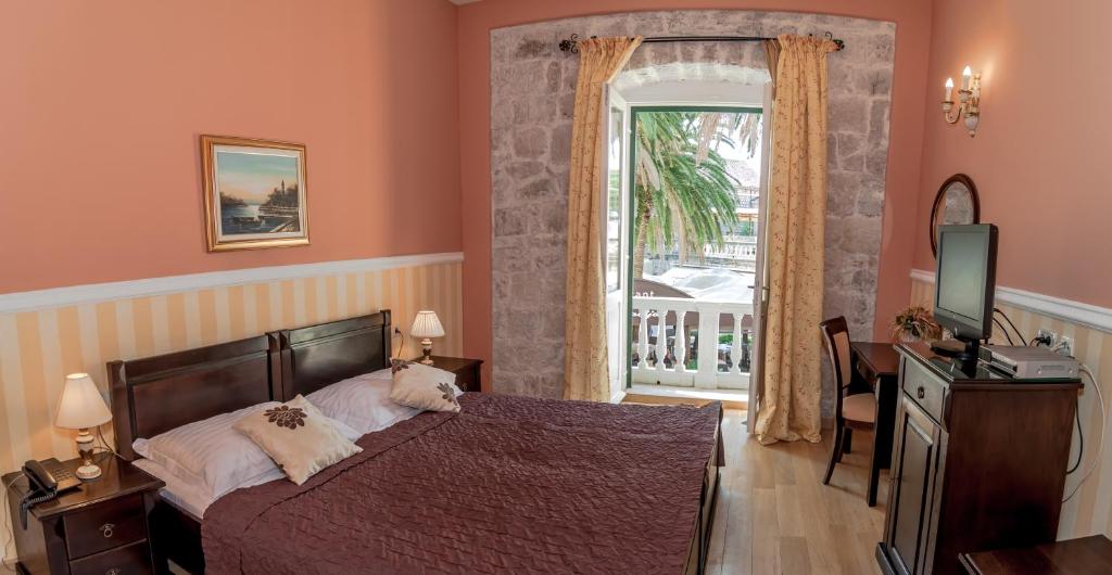 Postel nebo postele na pokoji v ubytování Boutique Hotel Villa Pattiera