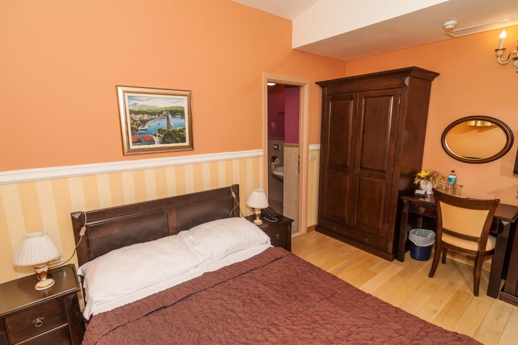 Postel nebo postele na pokoji v ubytování Boutique Hotel Villa Pattiera