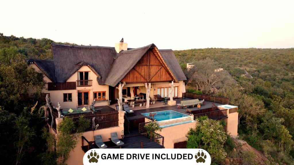 an aerial view of a house with a swimming pool at Phumelo Lodge in Bela-Bela