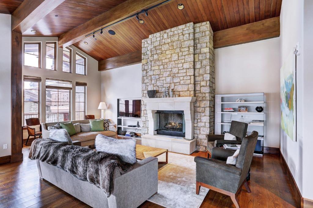 a living room with a couch and a fireplace at Lodge at Vail, A RockResort in Vail