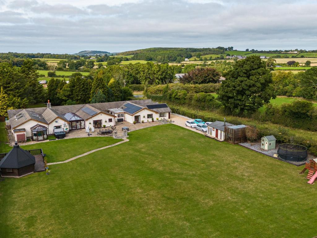 an aerial view of a house with a large lawn at Brookway Lodge in Holywell
