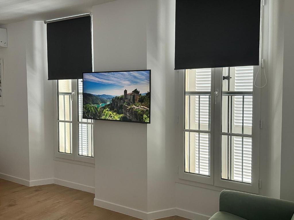 TV a/nebo společenská místnost v ubytování Résidence Terminus - appartements