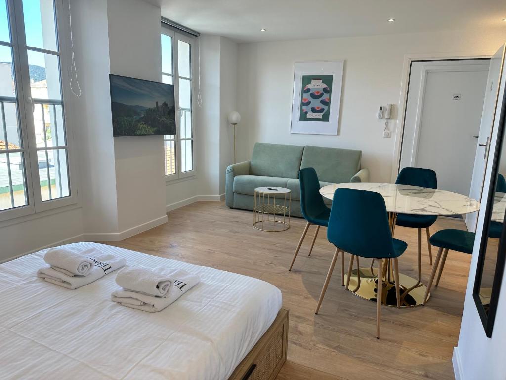 Postel nebo postele na pokoji v ubytování Résidence Terminus - appartements