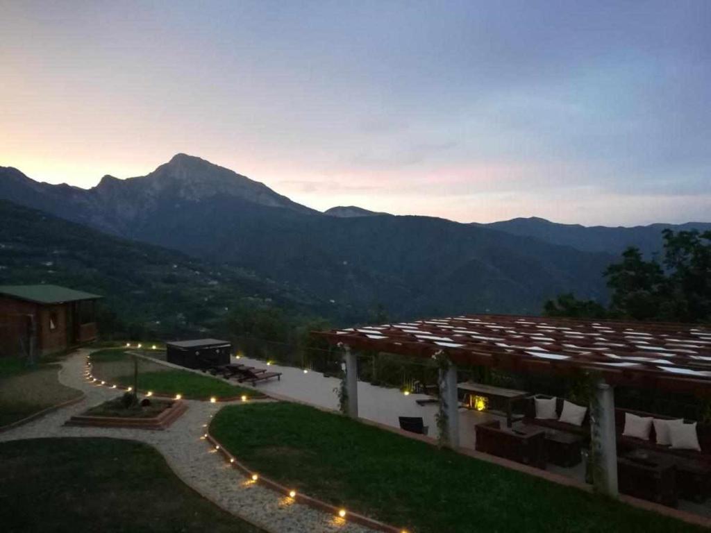 a view of a building with mountains in the background at Agriturismo Al Pagan in Pigna