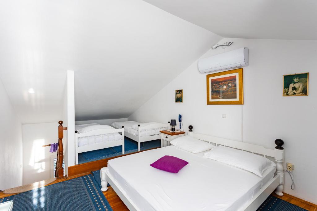 Postel nebo postele na pokoji v ubytování Villa Amigo