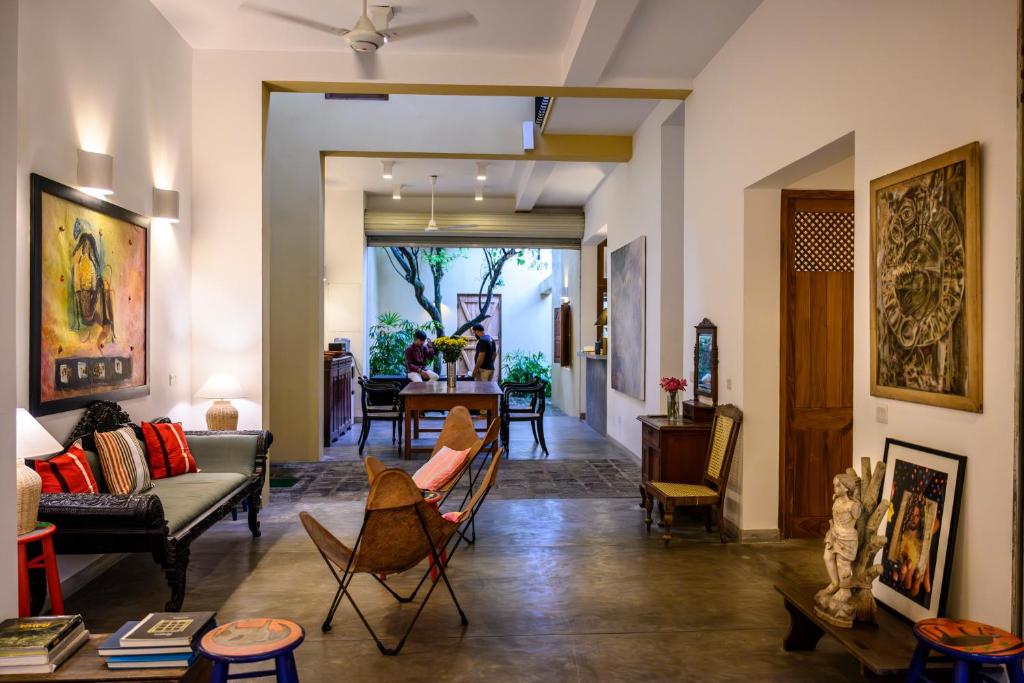 a living room with a couch and chairs at 50 CHURCH STREET - GALLE FORT in Galle