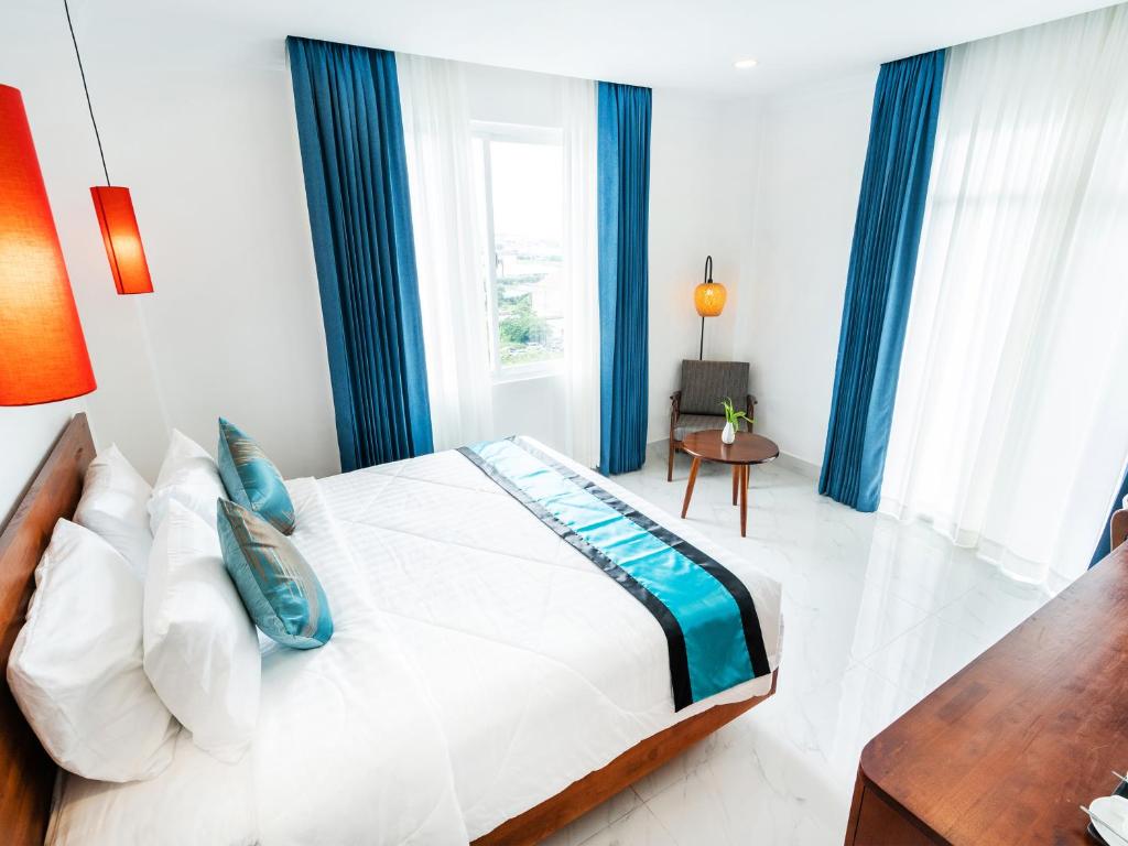 Postel nebo postele na pokoji v ubytování Le Kree Downtown Hotel