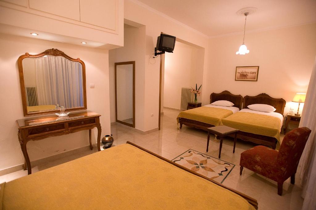 Postel nebo postele na pokoji v ubytování Hotel Urania