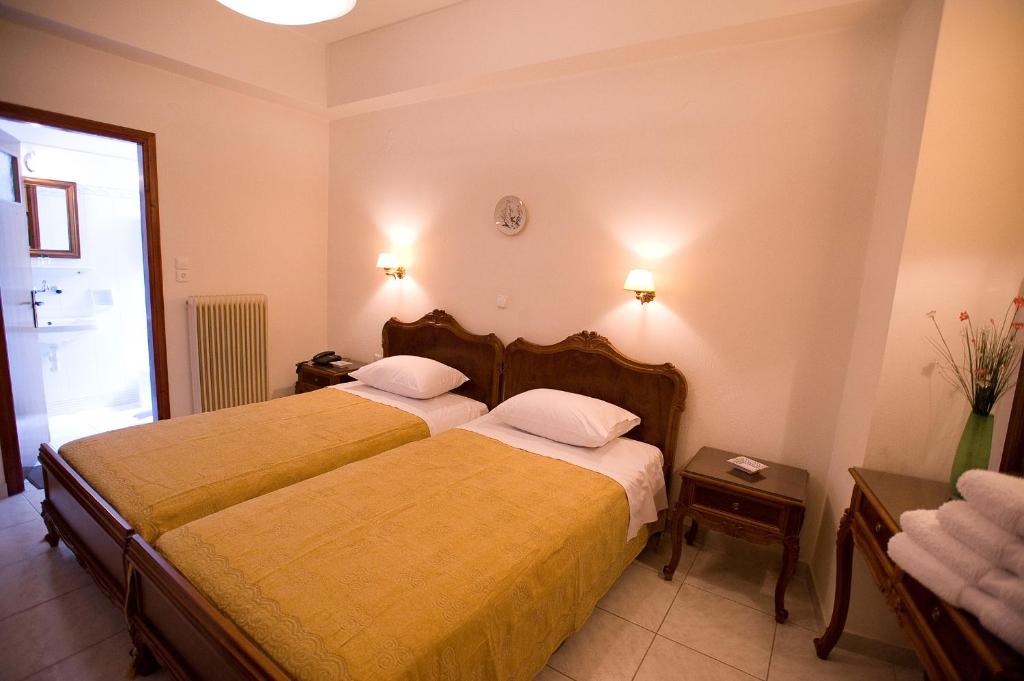 Postel nebo postele na pokoji v ubytování Hotel Urania