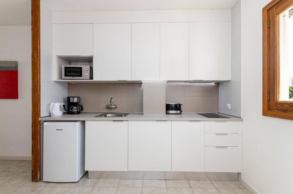 Kuchyň nebo kuchyňský kout v ubytování Mar Brava Apartments
