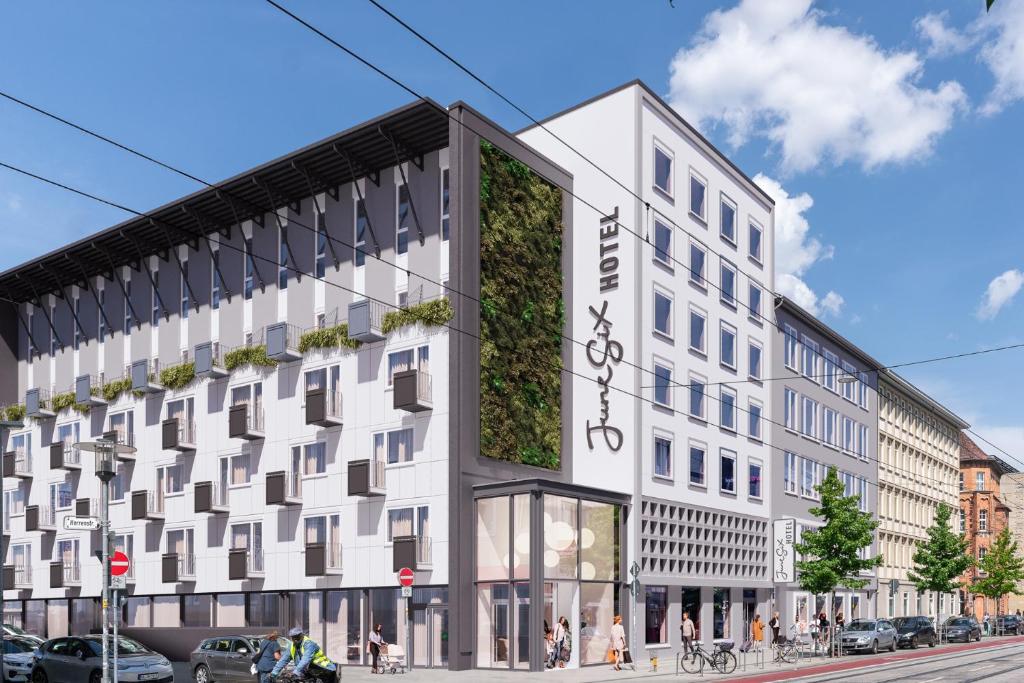 an architectural rendering of a building with a green wall at June Six Hotel Hannover City in Hannover