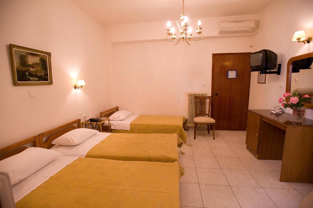 Postel nebo postele na pokoji v ubytování Hotel Urania