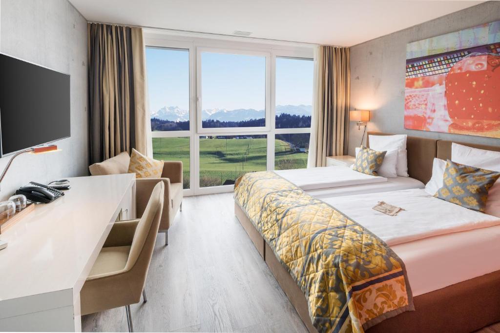 Postel nebo postele na pokoji v ubytování Hotel Swiss Star