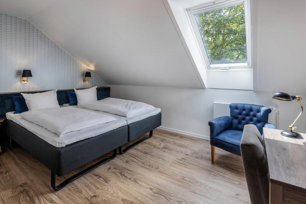 Postel nebo postele na pokoji v ubytování Hotel Scheelsminde