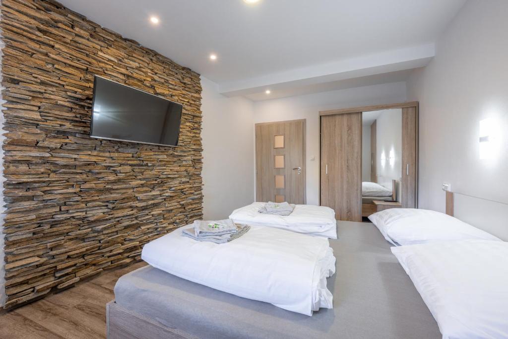 Ένα ή περισσότερα κρεβάτια σε δωμάτιο στο Apartmán Karin