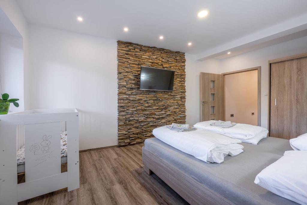 Postel nebo postele na pokoji v ubytování Apartmán Karin