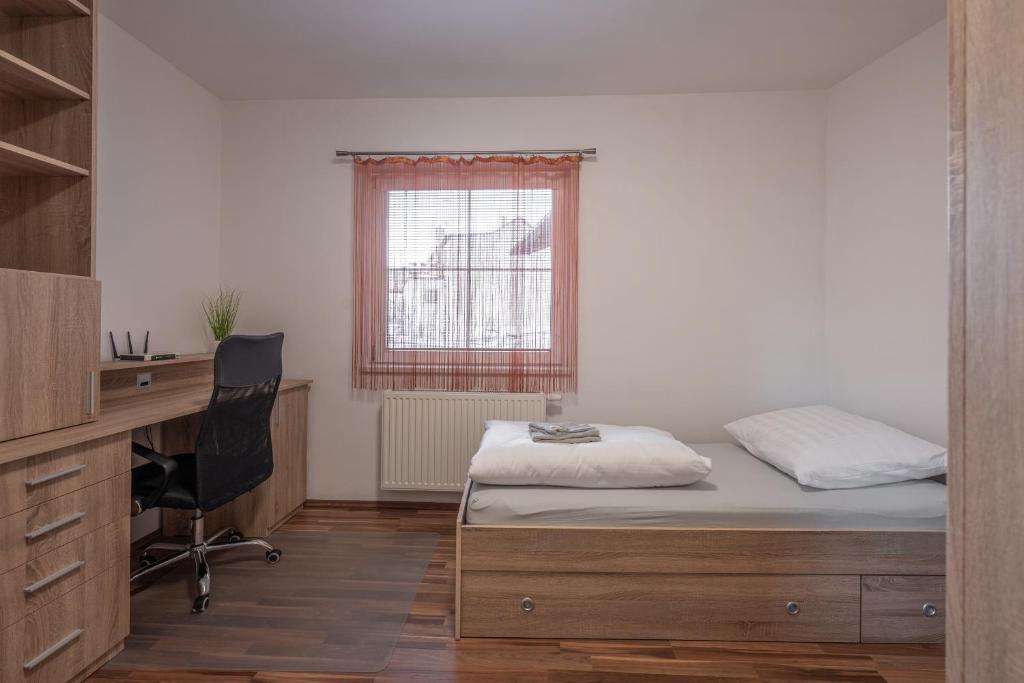 Postel nebo postele na pokoji v ubytování Apartmán Karin
