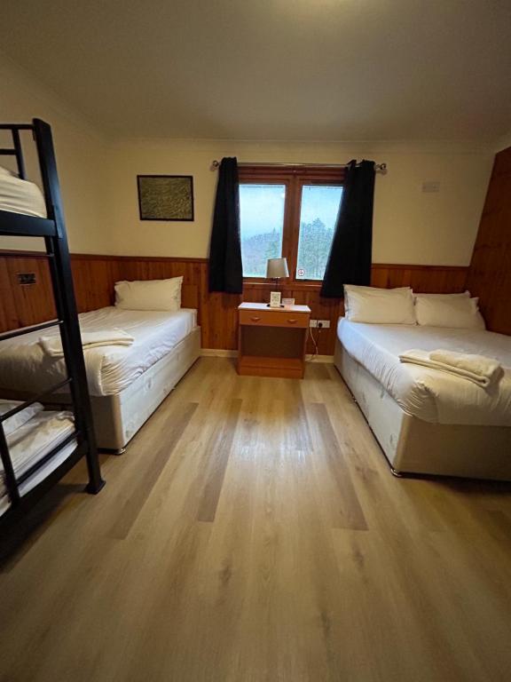 Postel nebo postele na pokoji v ubytování Roam West