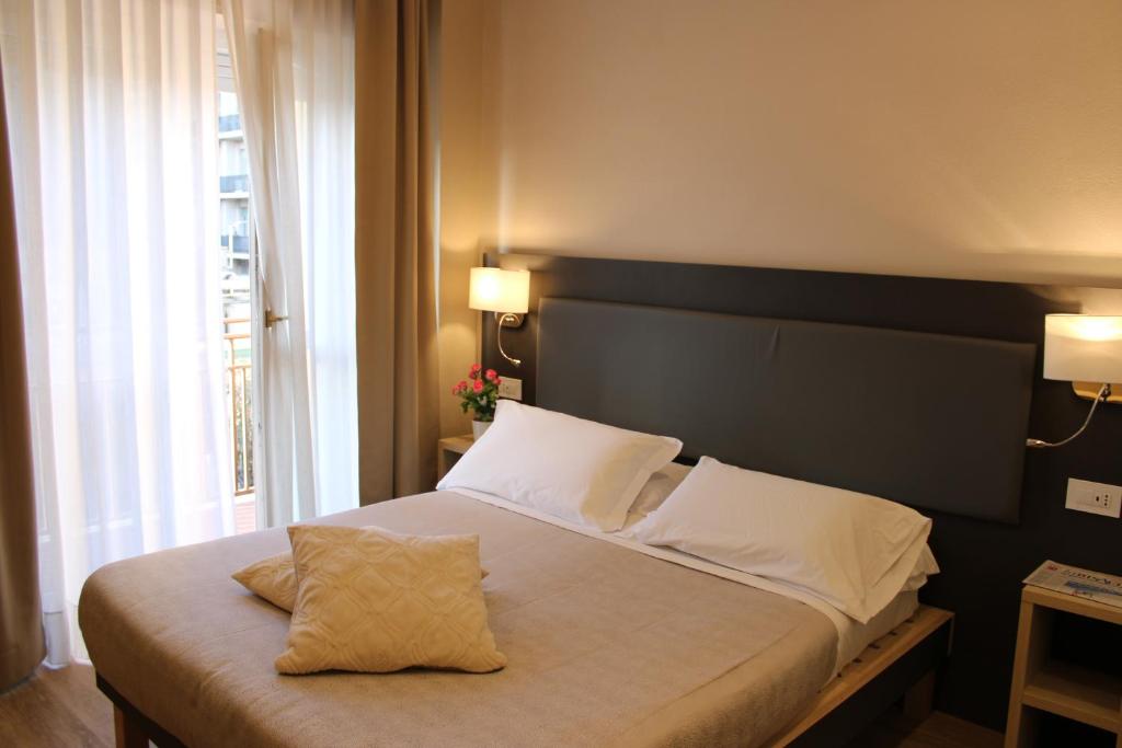 Postel nebo postele na pokoji v ubytování Hotel Victoria