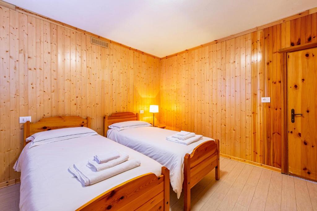Postel nebo postele na pokoji v ubytování Casa Fiocco di Neve