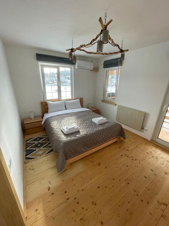 Postel nebo postele na pokoji v ubytování Nafta Aparts & Villas