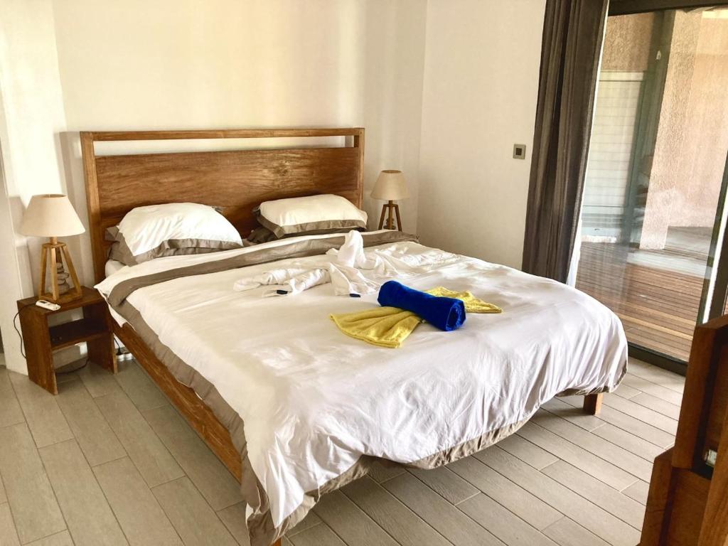 Postel nebo postele na pokoji v ubytování Villa Teranga avec vue panoramique sur la baie de Tamarin