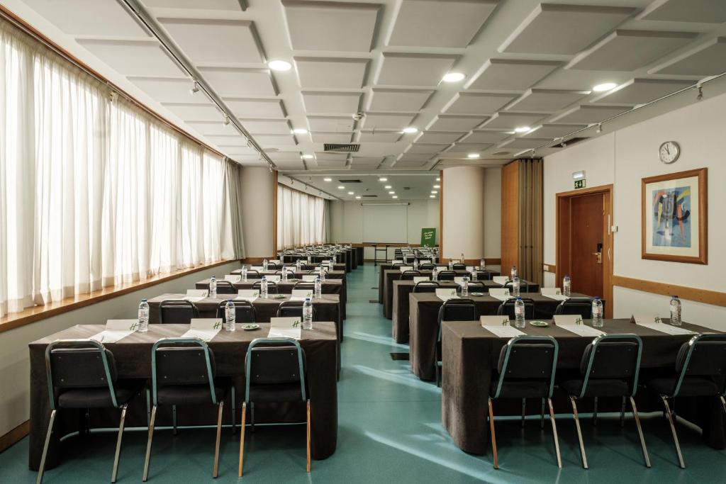 A large classroom-style conference room with extensive natural light.