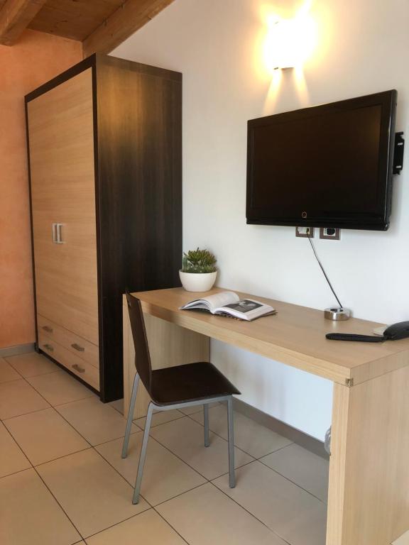 TV a/nebo společenská místnost v ubytování BE HOME Fiera