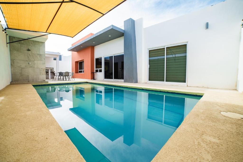 a swimming pool in the backyard of a house at VILLA COSTA FELIX 1 in Puerto Peñasco