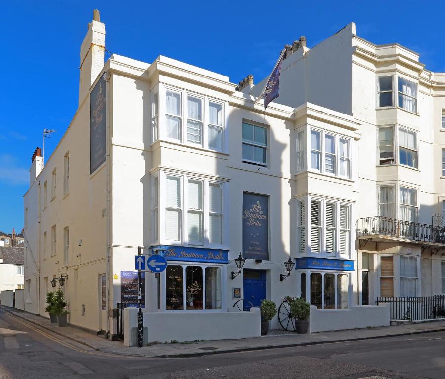 a white building on the corner of a street at The Southern Belle in Brighton & Hove