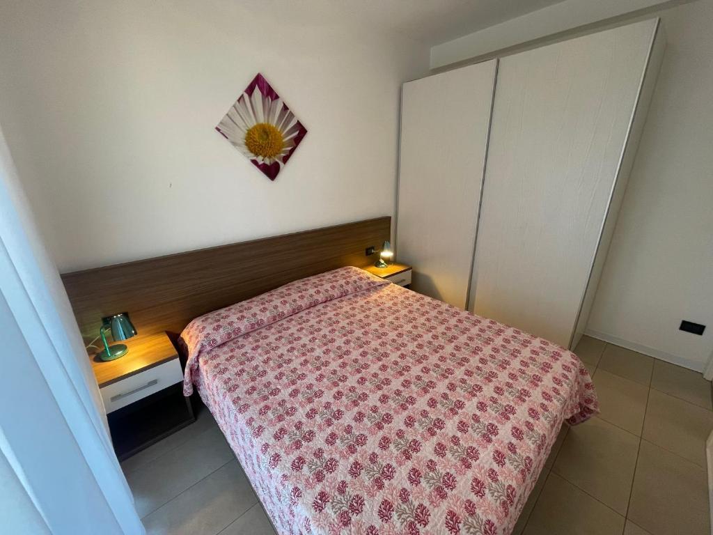 Postel nebo postele na pokoji v ubytování Villa Marina Apartments - Agenzia Cocal