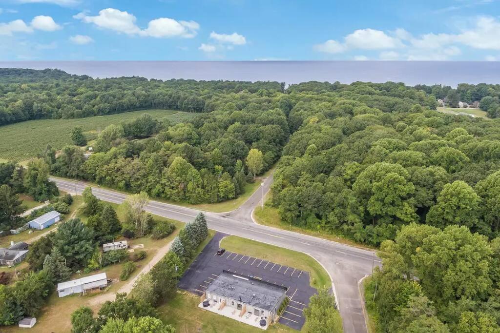 an aerial view of a road in the middle of a forest at A piece of Blue Haven in South Haven