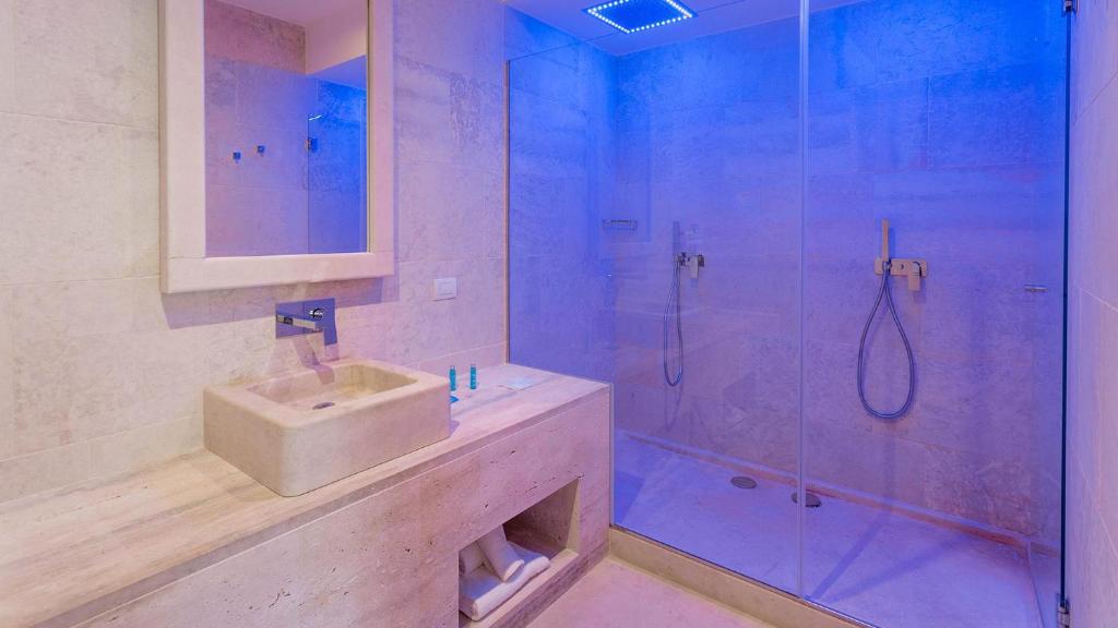 a bathroom with a shower and a sink and a shower at HOTEL BARONE DI MARE in Torre dell'Orso