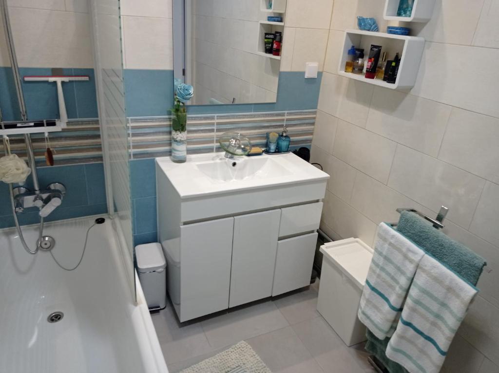 a bathroom with a sink and a toilet and a shower at Seixal Yachting Bay Apartments in Seixal
