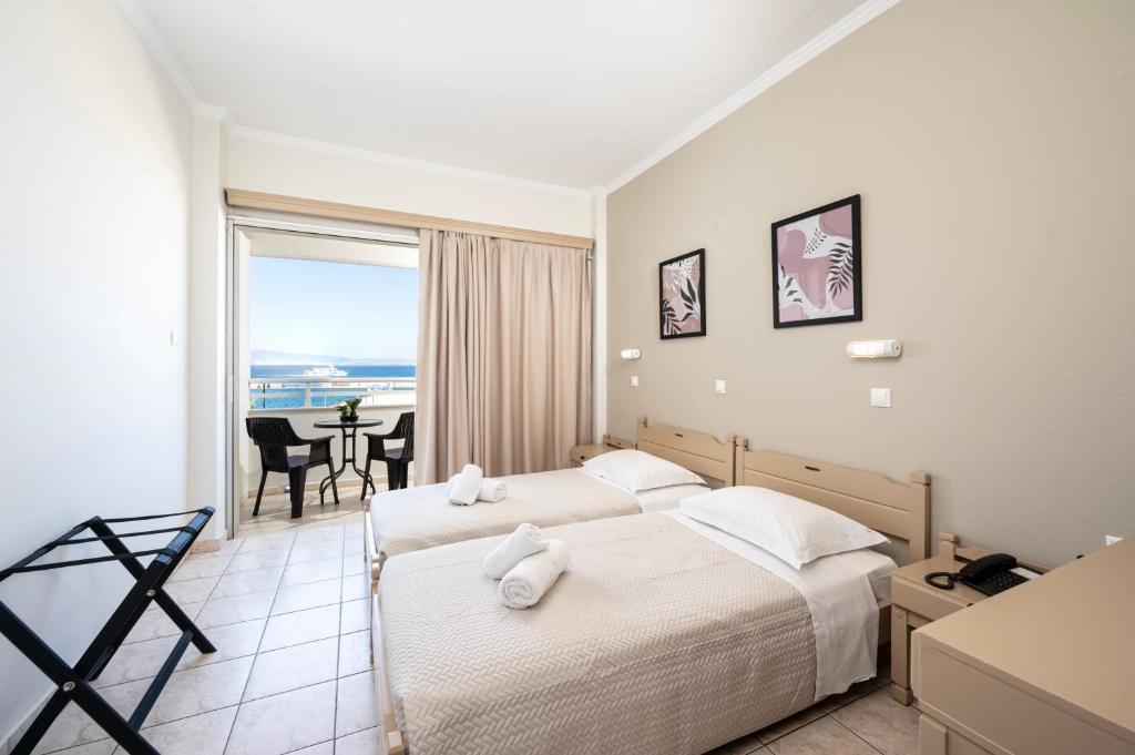 Postel nebo postele na pokoji v ubytování Zephyros Hotel