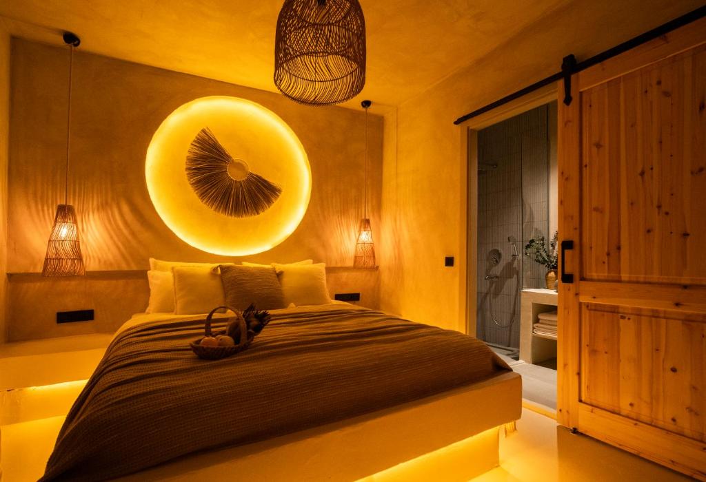 a bedroom with a bed with a yellow wall at Noi Hotel Bodrum in Bodrum City