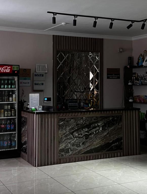 a bar in a store with a counter in a room at Комплекс Изумруд in Astana