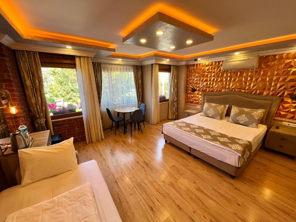 a bedroom with a bed and a table in it at Meydan Suites in Istanbul