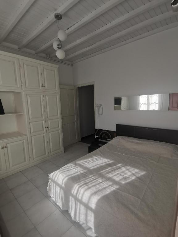 Postel nebo postele na pokoji v ubytování VILLA VASILIS ORNOS