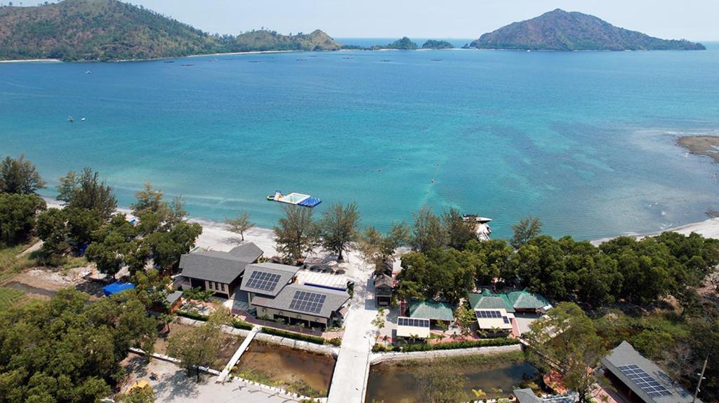 an aerial view of a beach with a house and the water at Emon Pulo Beach Resort 