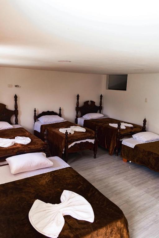 Postel nebo postele na pokoji v ubytování Hotel Campestre La Francesina