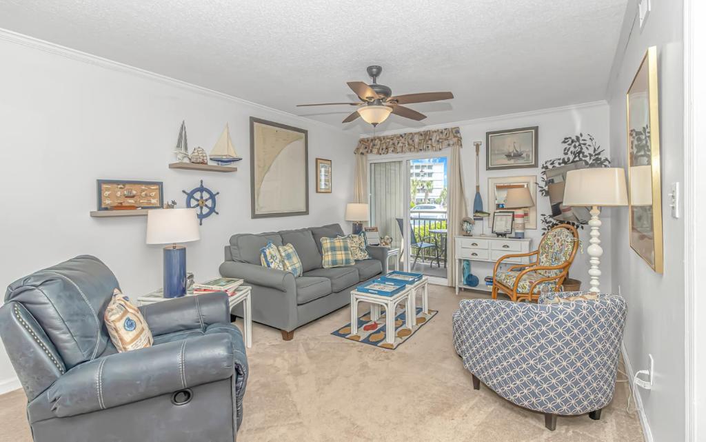 a living room with a couch and chairs and a ceiling fan at Fishing Dock, Trailer Parking, Gated, Beach Access in Myrtle Beach