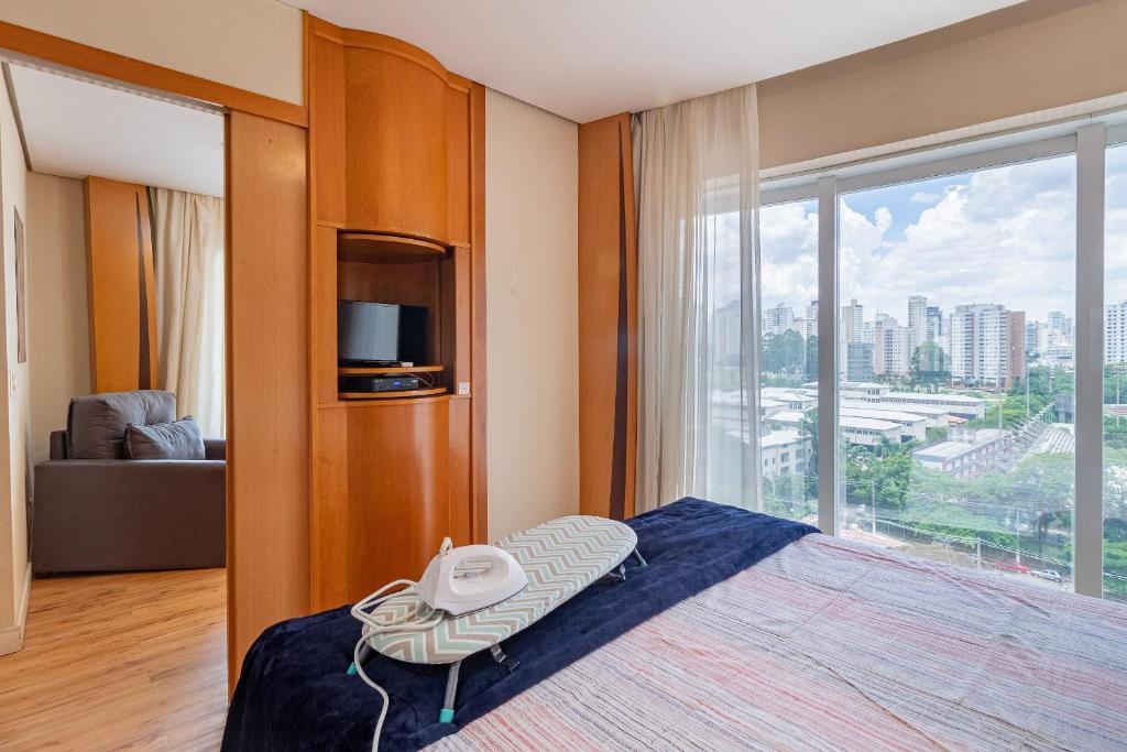 En eller flere senge i et værelse på LFlats no Hotel Stella Vega (EX-Mercury Ibirapuera)