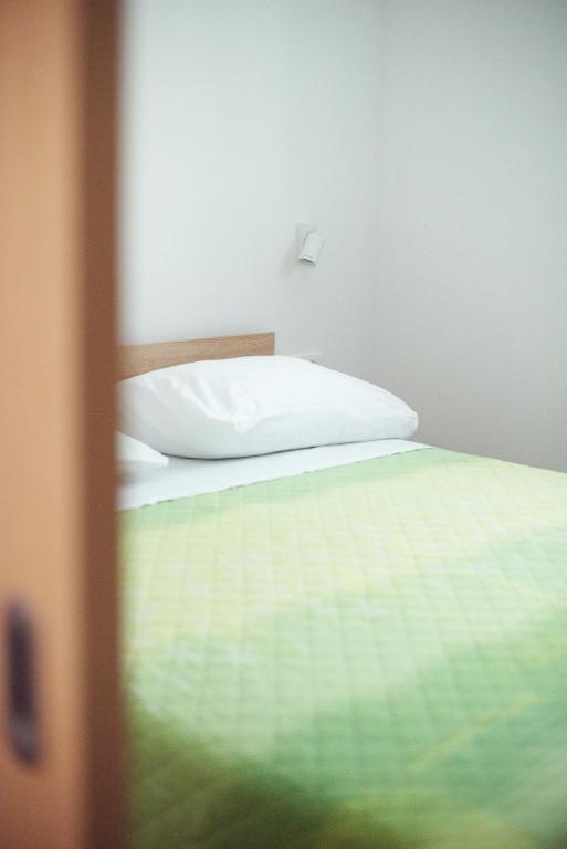 Postel nebo postele na pokoji v ubytování Apartmani Tomica