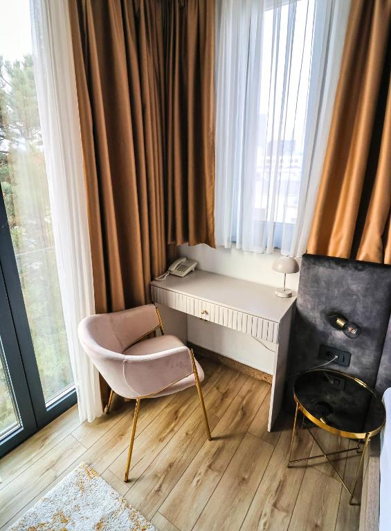 Łóżko lub łóżka w pokoju w obiekcie Hotel National