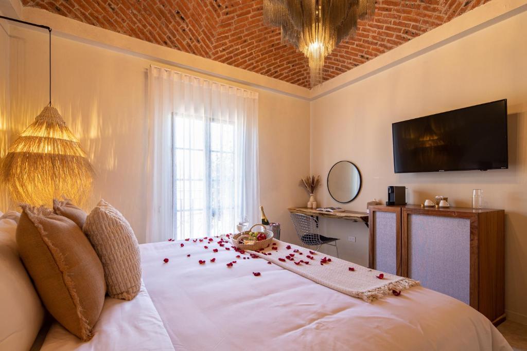 TV a/nebo společenská místnost v ubytování HOLT Hotel del Pueblito