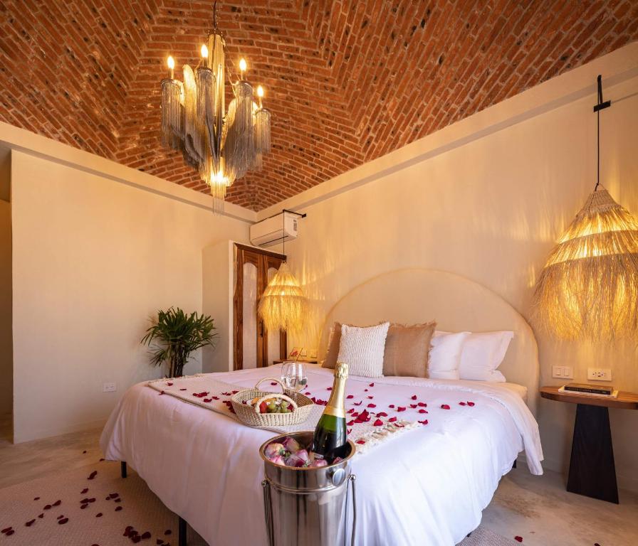 Postel nebo postele na pokoji v ubytování HOLT Hotel del Pueblito